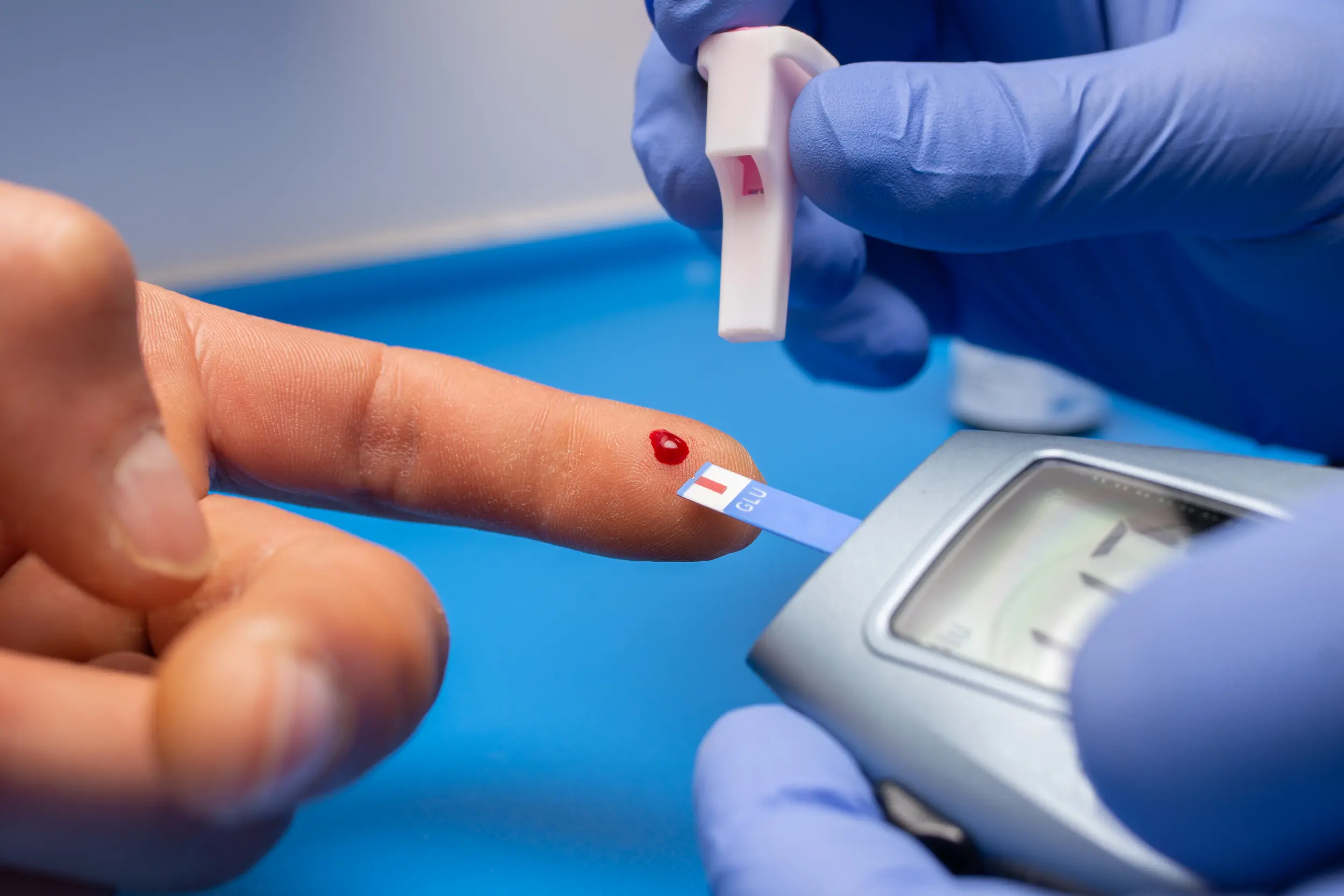 closeup-shot-doctor-with-rubber-gloves-taking-blood-test-from-patient.webp