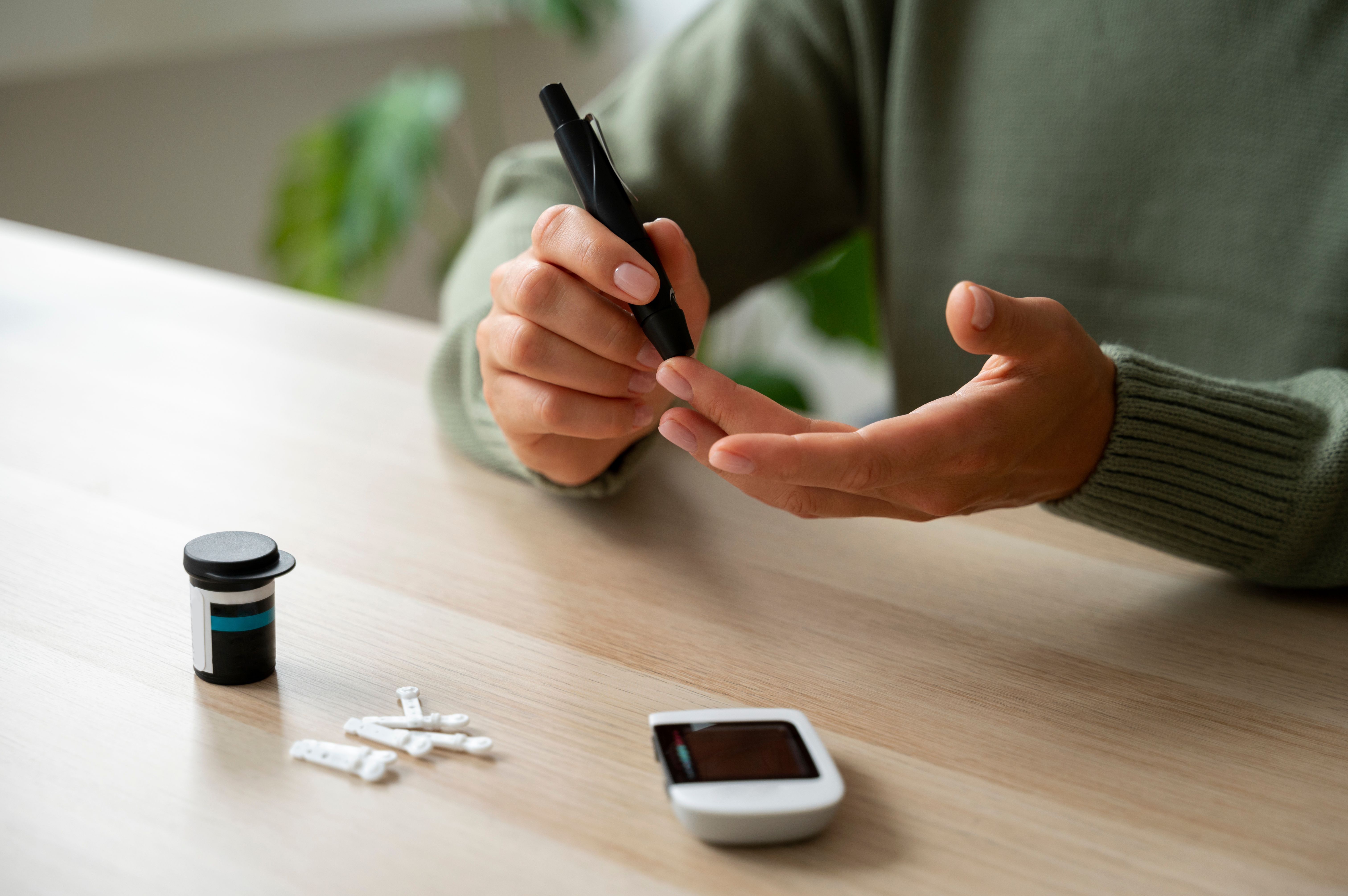 side-view-diabetic-woman-checking-her-glucose-level.jpg